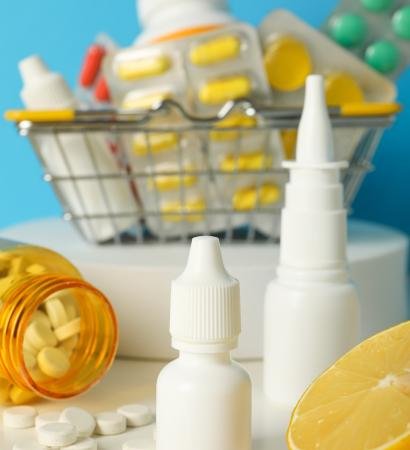 Pills in a metal basket. Concept of winter medicine Pills in a metal basket. Concept of winter medicine